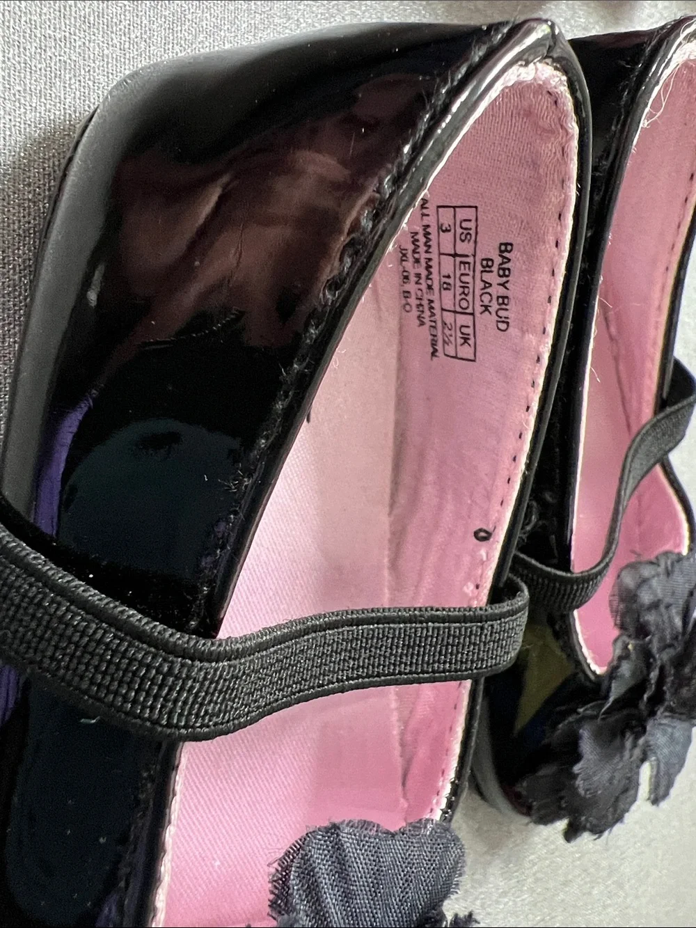 Stuart Weitzman Black Patent Mary Jane Shoes with Flower Accent